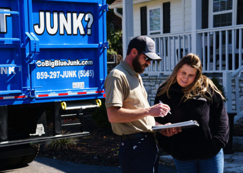 Paris junk removal professional interacting with a client